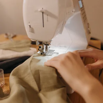 A sewing machine stitching a cloth.